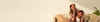 Image banner of a man wearing the Elite device and a woman wearing the Professional device sitting on a couch.