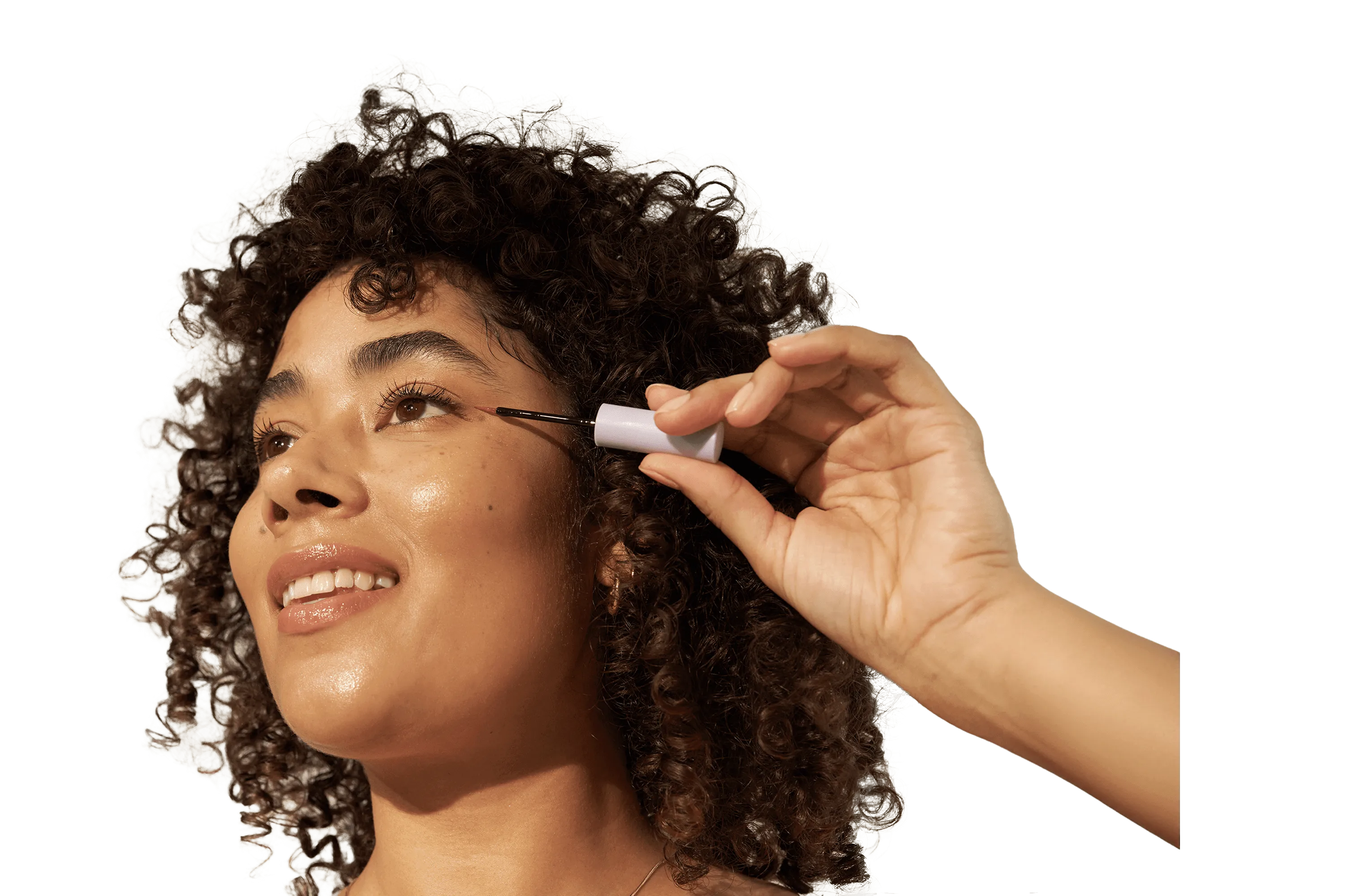 Woman applying eyelash enhancing serum