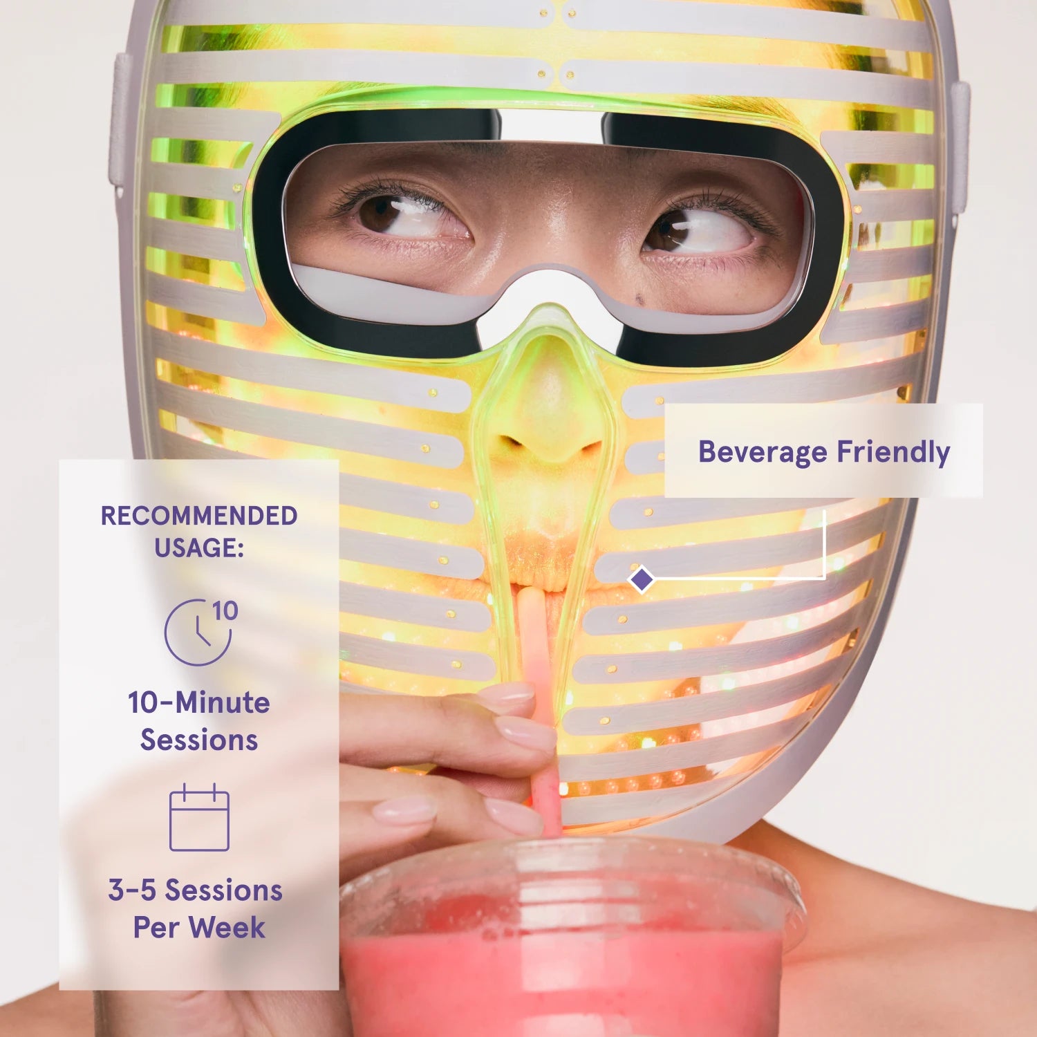 woman drinking through a straw while wearing the face mask pro, labeled "Beverage Friendly" with usage recommendations of 10-minute sessions, 3 to 5 times per week.
