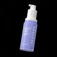 Purple retinol serum bottle with white pump labeled 'iRestore' on a black background