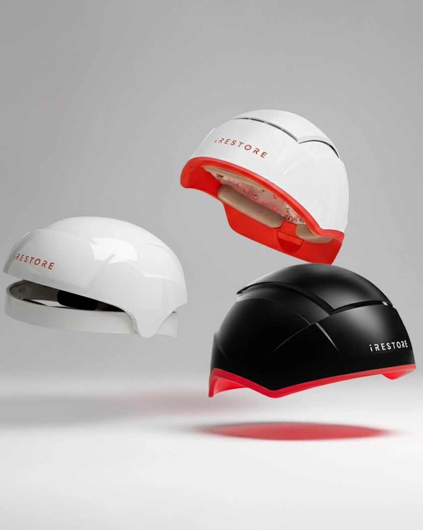 Three hair restoration devices with 'iRestore' branding on a gray background
