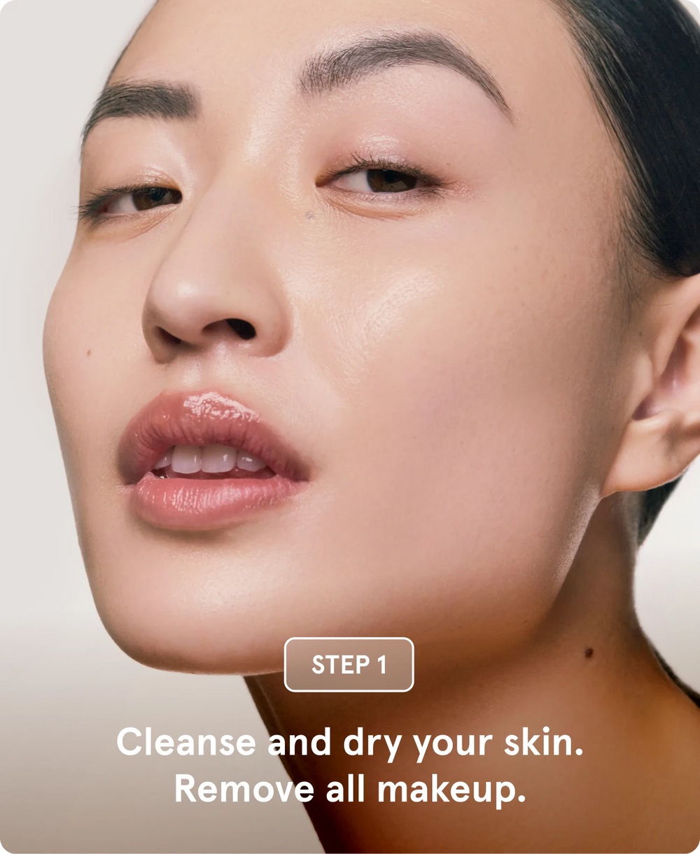 Close-up of a woman's face with clear skin and a trace of serum on her cheek, featuring text labeled "STEP 1: Cleanse and dry your face and neck."