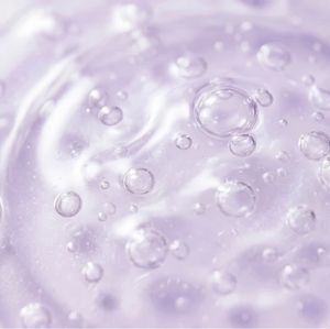 light purple, translucent gel serum filled with tiny bubbles.