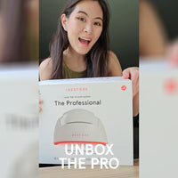 Woman unboxing the iRESTORE professional device