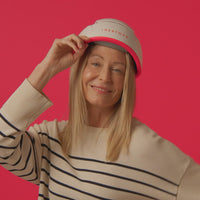 Short clip of a woman wearing the Professional hair device showing it in front and side view.