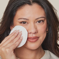 woman showcasing and applying the eyebrow enhancing serum