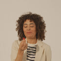 Woman eating biotin gummies