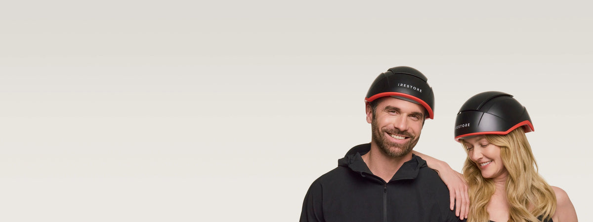 man and woman smiling, wearing irestore elite
