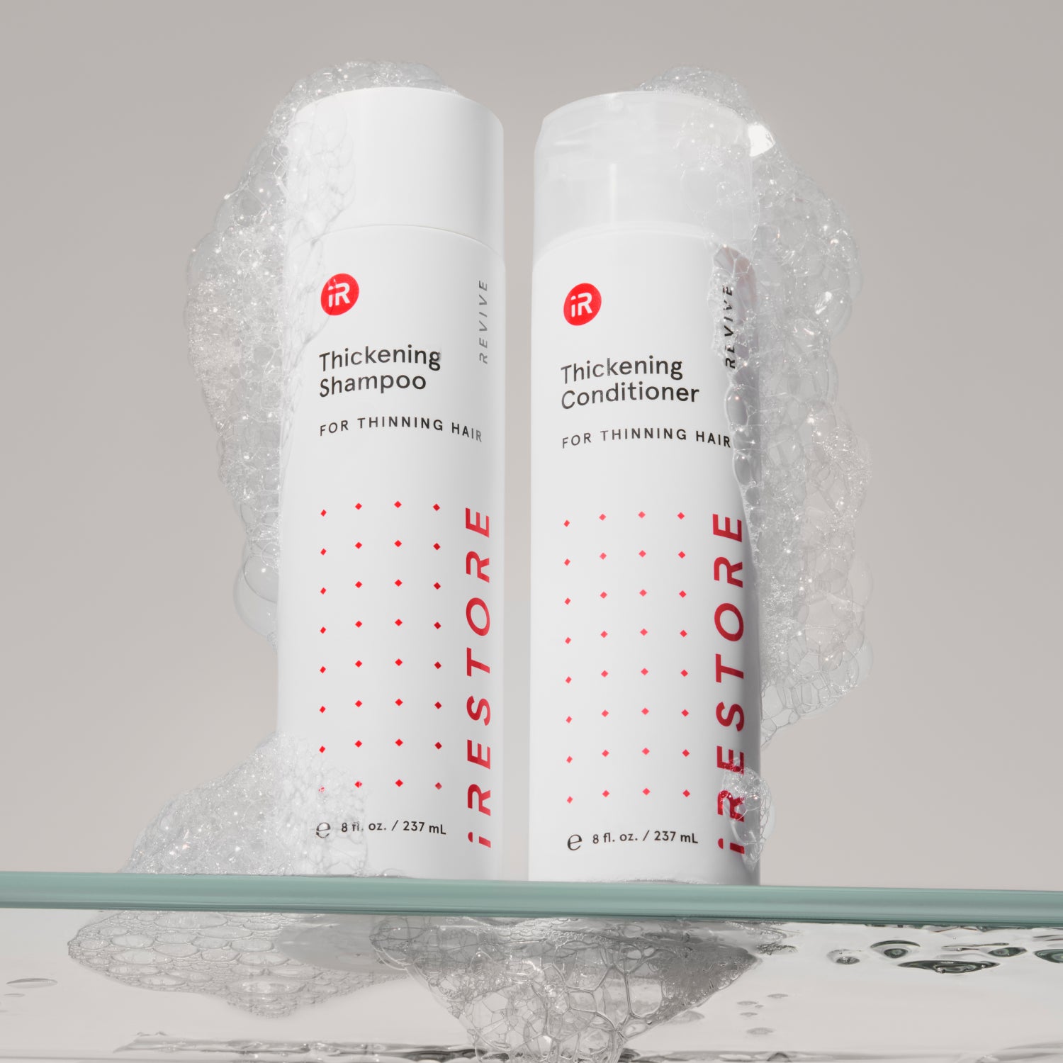 thickening shampoo and conditioner bottles with bubbles
