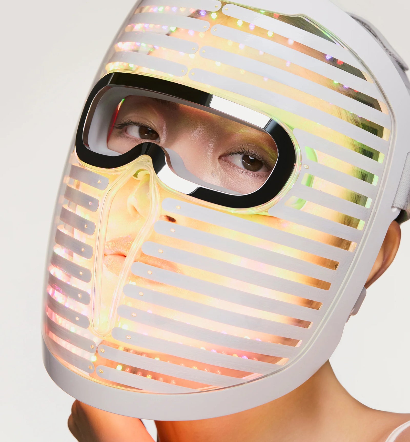 woman wearing the Face Mask Pro glowing with yellow lights