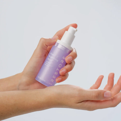 close up shot of vitamin c serum being applied on hand