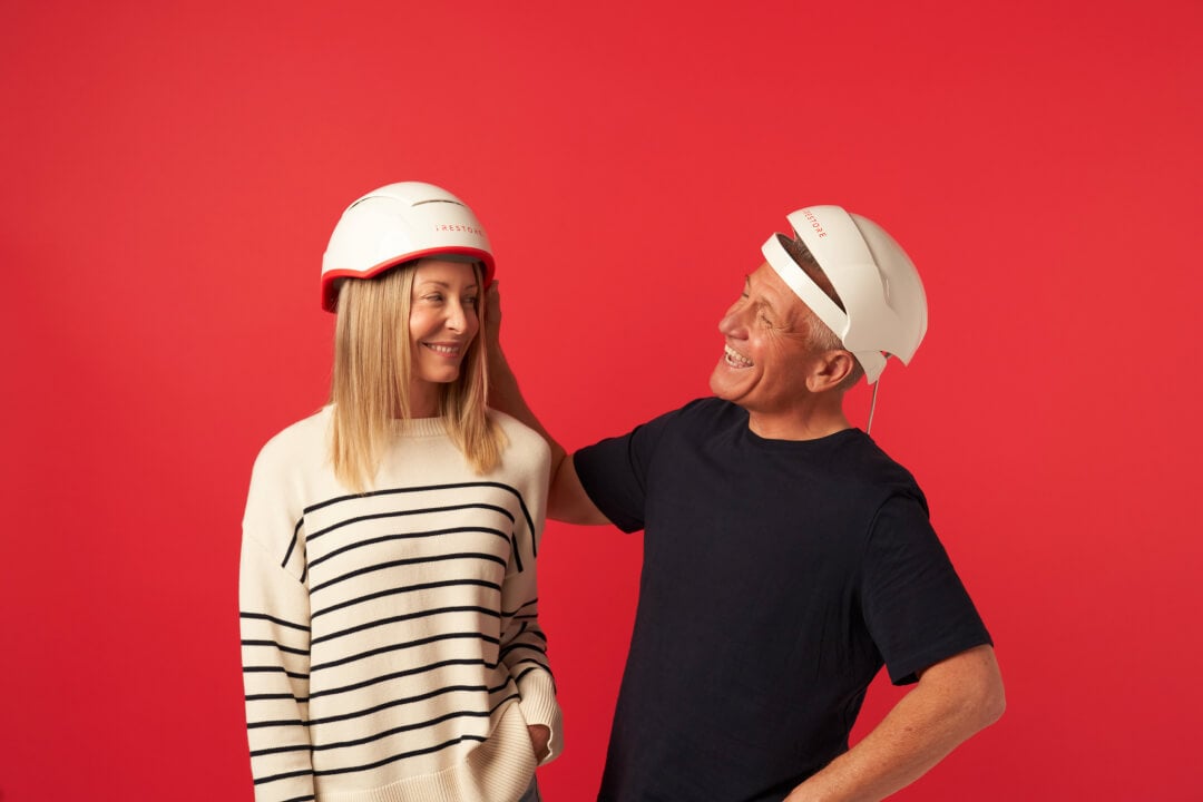 Image shows a matured man wearing the Essential device and a mature woman wearing the Professional Device.