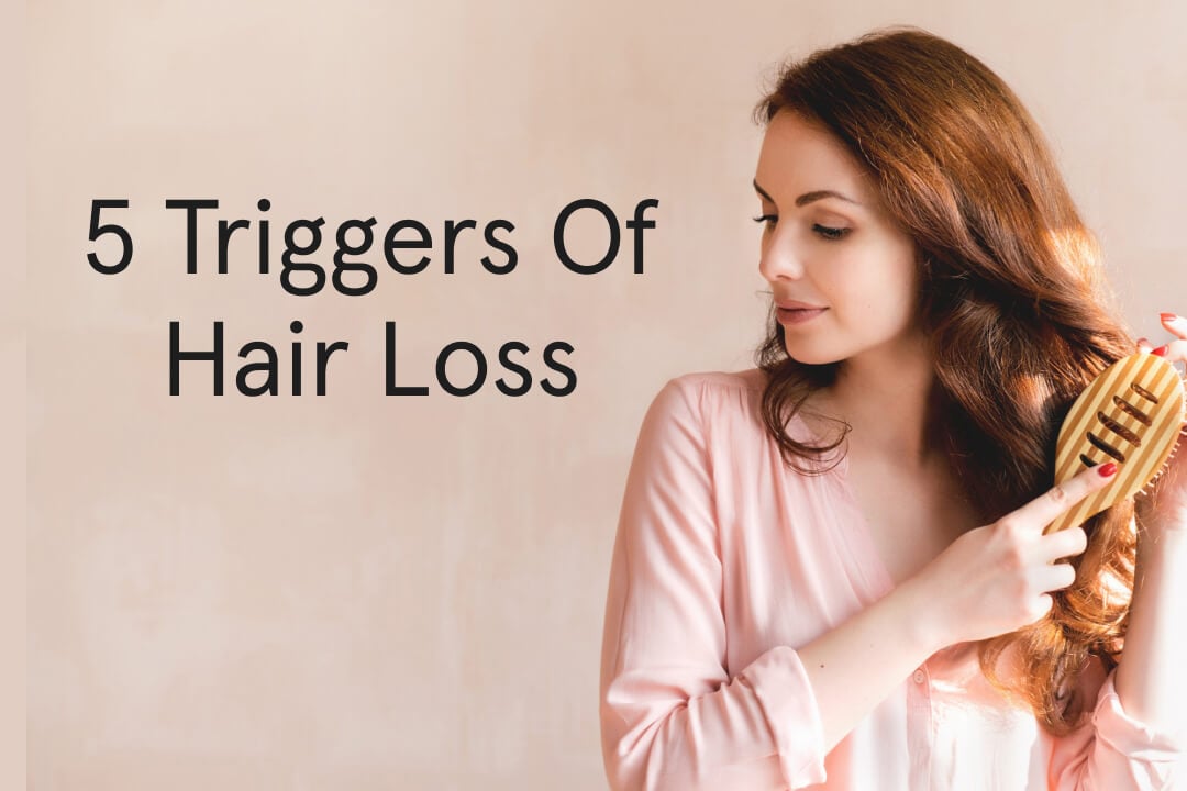5 triggers of hair loss. Woman combing her hair.
