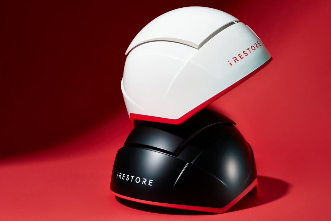 Image showing the Elite device and the Professional device placed on top of it.