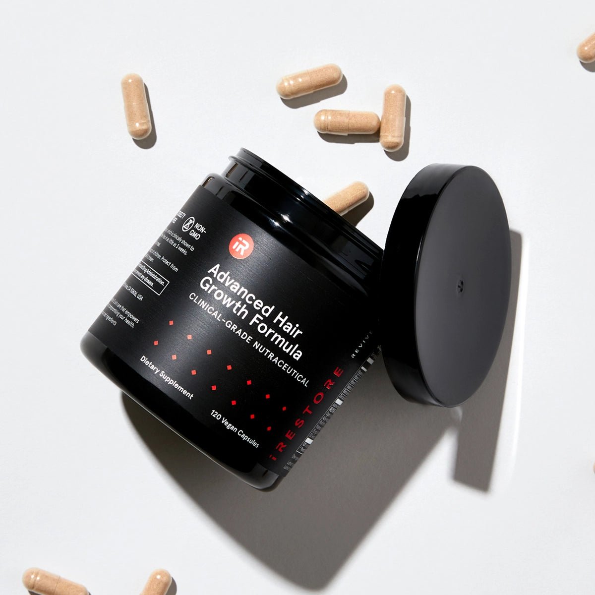 Opened Advanced Hair Growth Formula on gray background