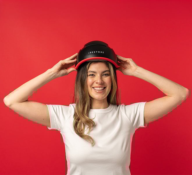 Image of a woman wearing the Elite device helmet.