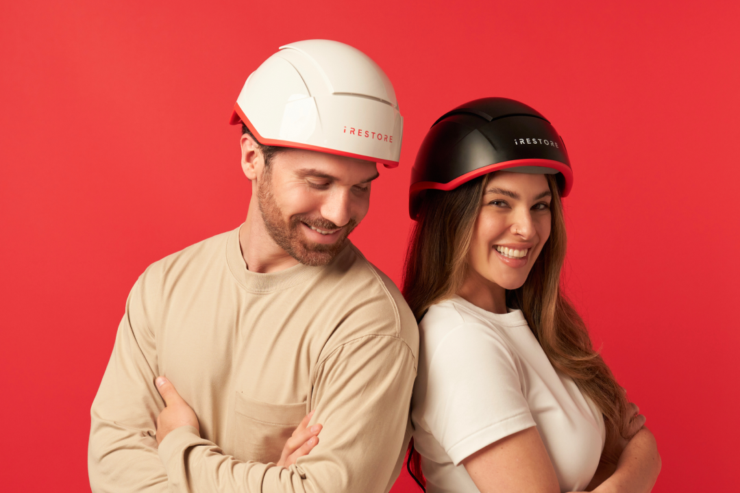 Image shows a man wearing the Professional Device and a woman wearing the Elite device in side view angle.