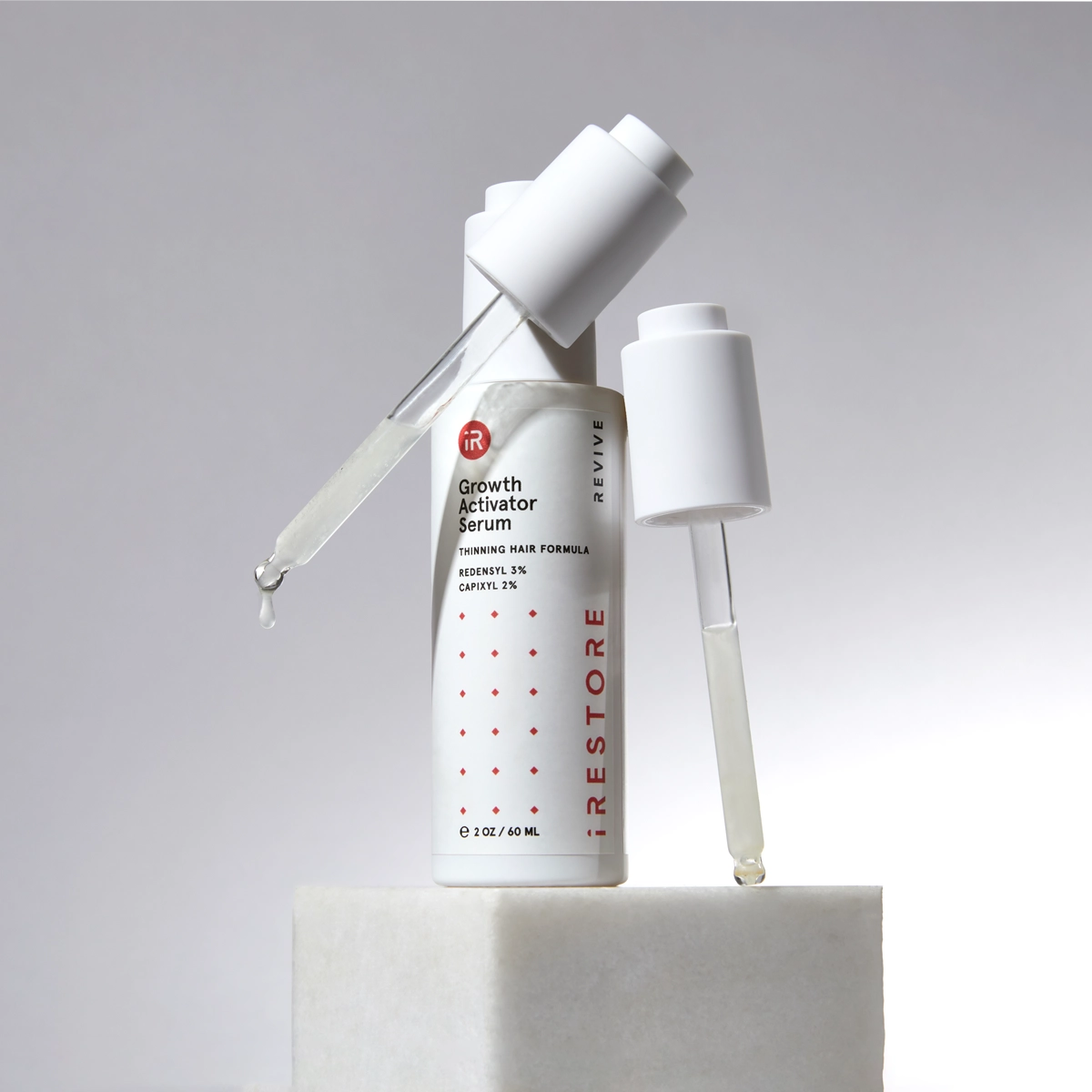 iRESTORE Serum with gray background