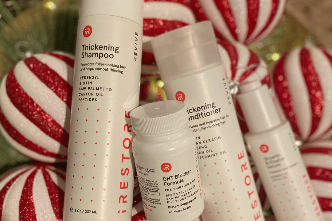 Image showing the REVIVE Max Growth Kit with Christmas balls behind it.