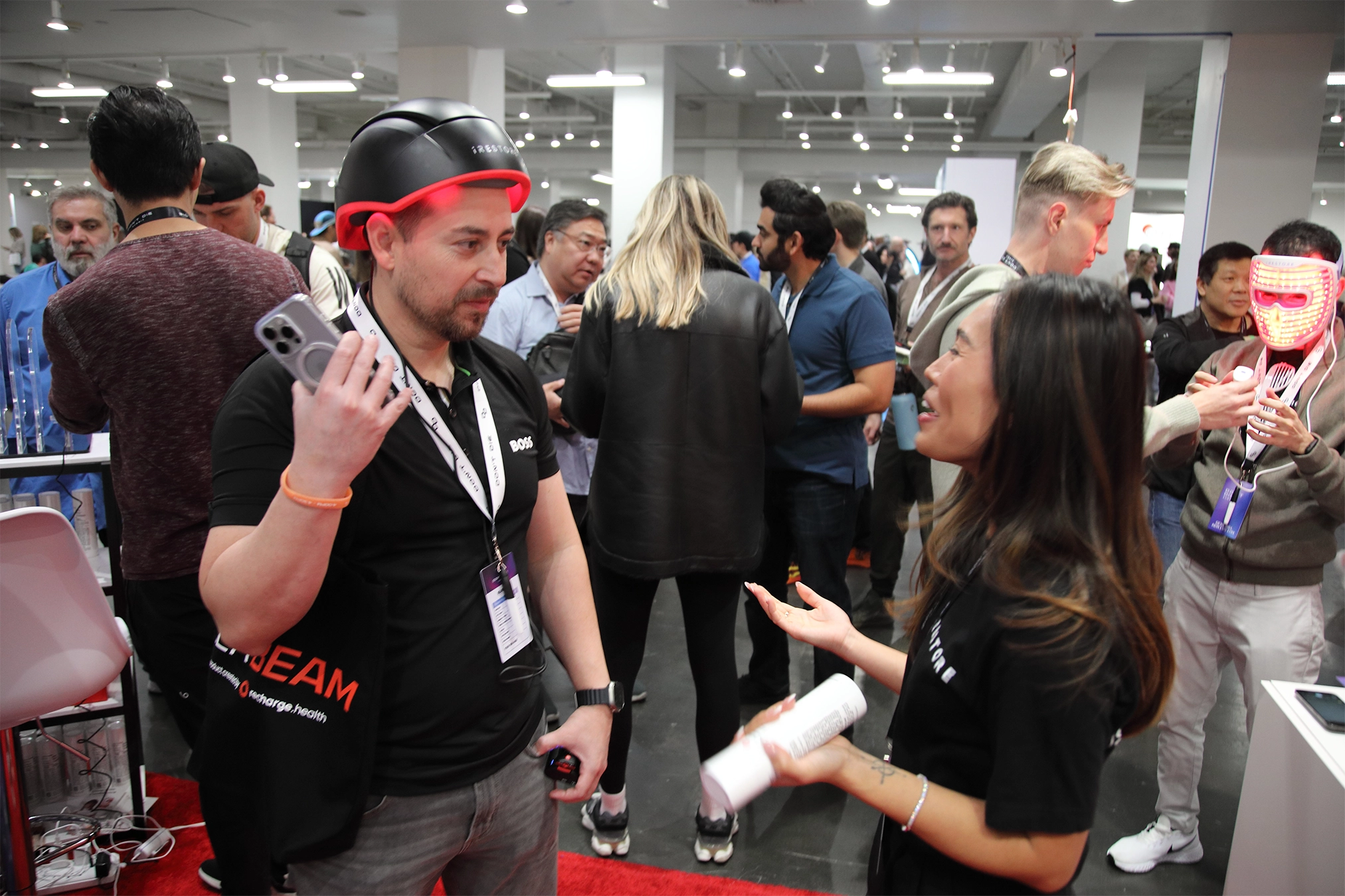 attendee of Don't Die Summit talking to iRESTORE staff